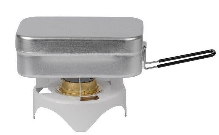 Aluminum Mess Tin with tight fitting lid being shown on a camping burner the handle is unfolded showing this tin can be used as a cooking pot.