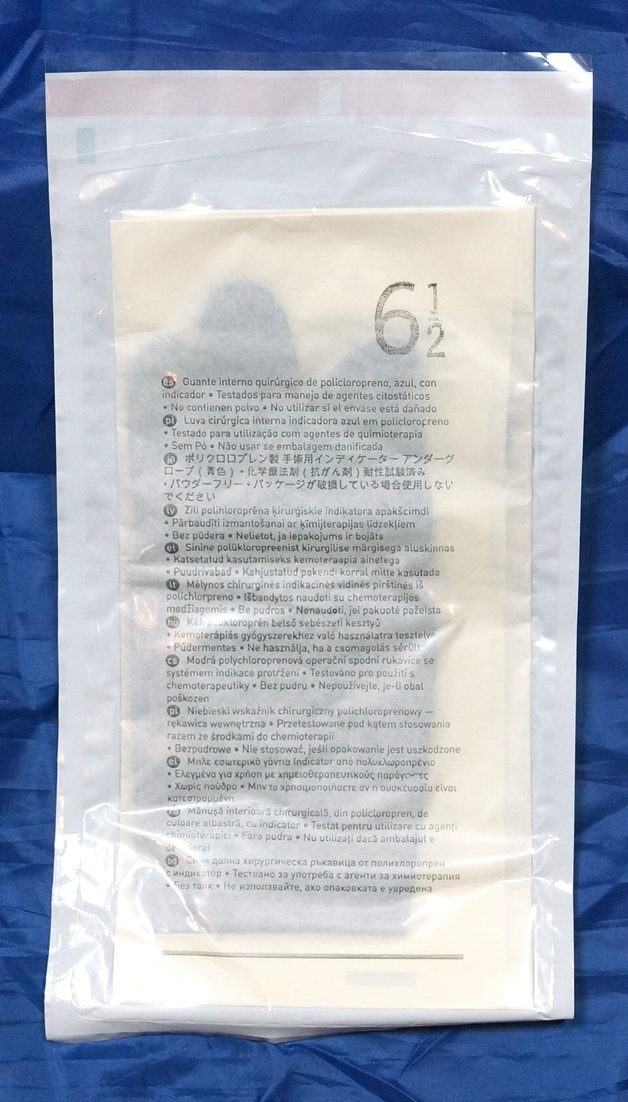 Mölnlycke Biogel Skinsense Indicator Underglove size 6.5 in a white and red sterile package, displayed against a blue textured background.