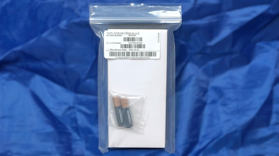 An open black hard case containing a ENT pocket light kit with multiple accessories, photographed on a white background.