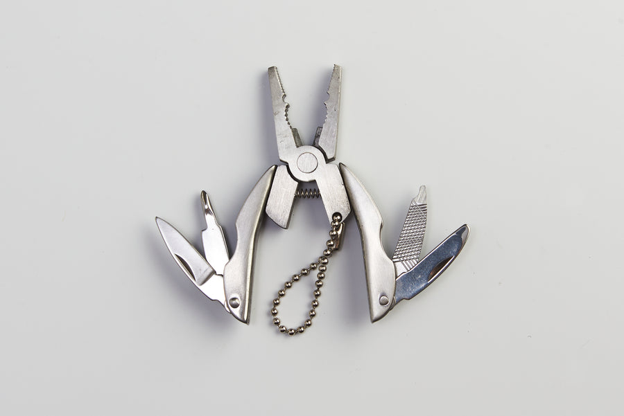 Multitool survival kit packaging on a white background
