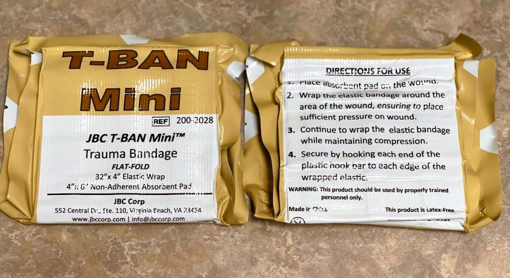 Front and back of JBC T-Ban Mini Trauma Bandage package showing how the bandage can be folded for smaller storage
